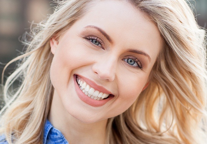 blonde woman smiling at camera