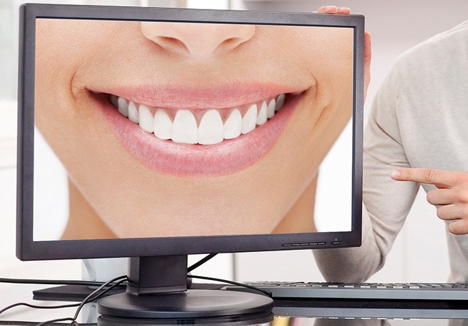 close up of smile on computer screen