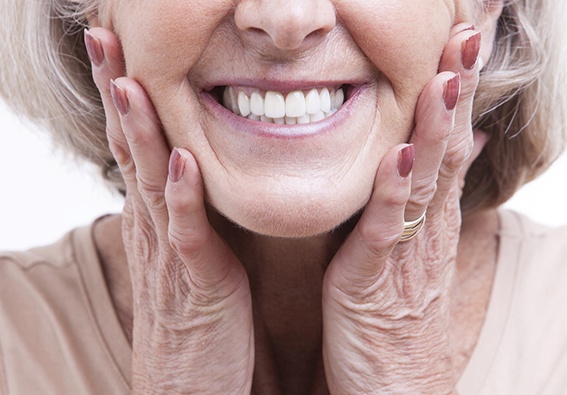 Closeup of woman with All On 4 implant dentures in Plainview 