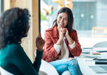 two women speaking 