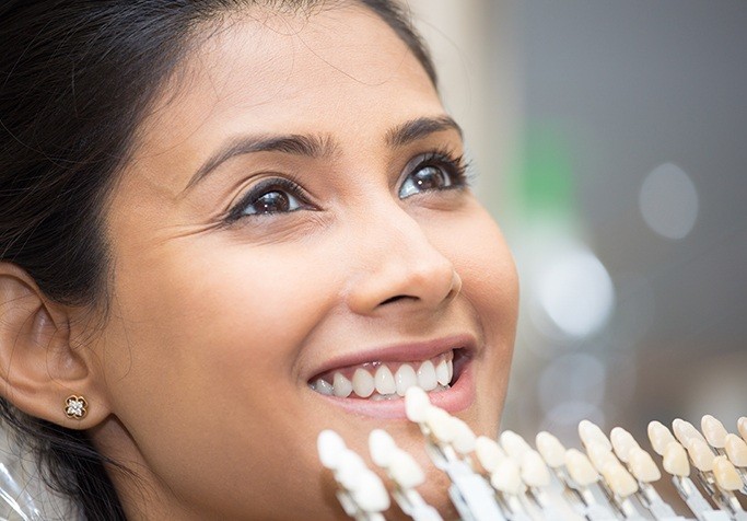 veneer chart in front of womans smile