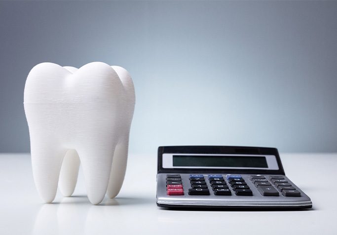 tooth and calculator for cost of cosmetic dentistry in Plainview 