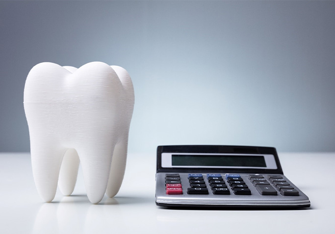 tooth and calculator for cost of cosmetic dentistry in Plainview