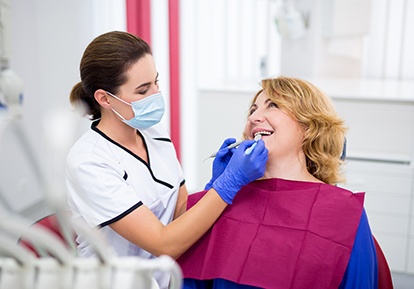 patient smiling while visiting dentist 