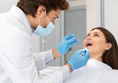 Woman visiting dentist in Planview