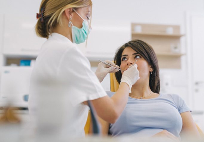 a patient speaking with their dentist