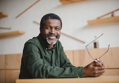 senior man sitting at a table