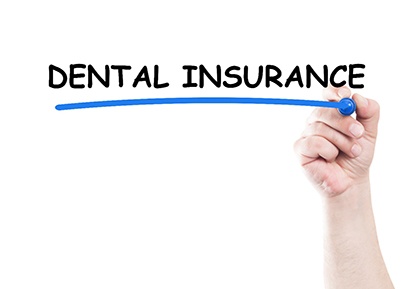 A person using a blue marker to draw a line under the words Dental Insurance in Plainview