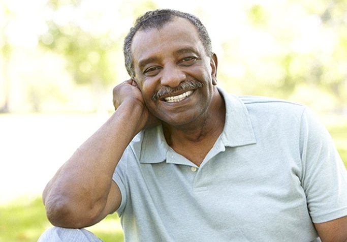 man smiling in a park