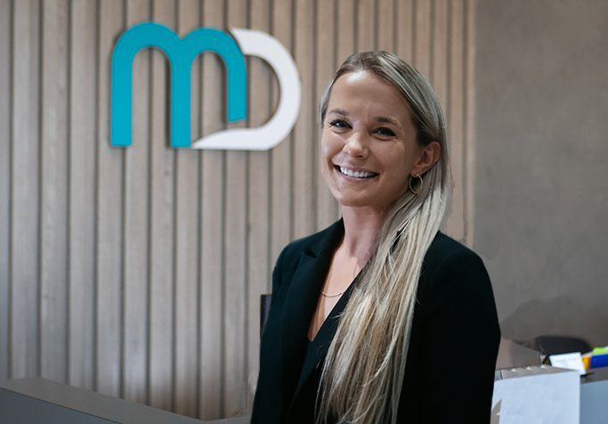 Plainview team member by Meadowbrook dentistry logo