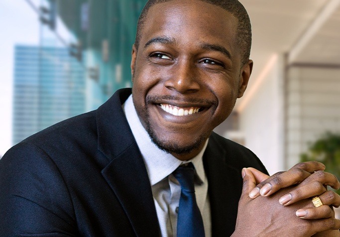 man in business suit smiling