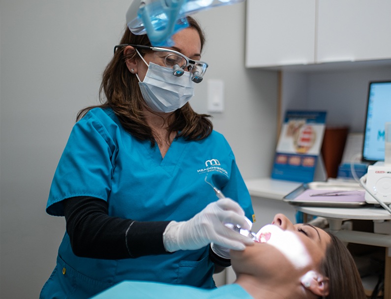 Plainview dentist focused with glasses and mask on