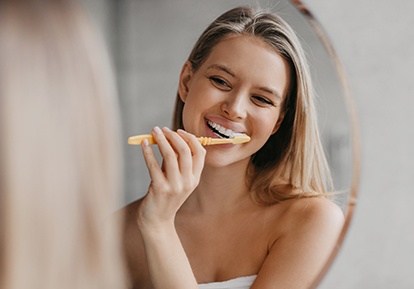 Woman brushing her teeth