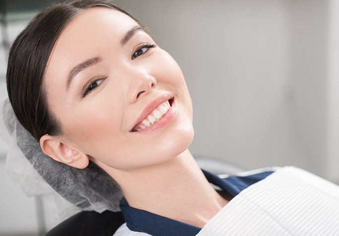 man smiling laying back in exam chair