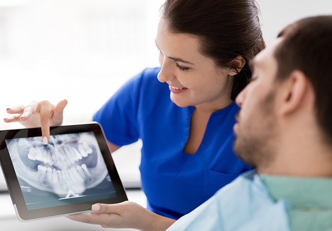 patient consulting with their dentist