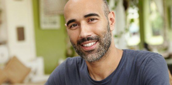 man with beard smiling