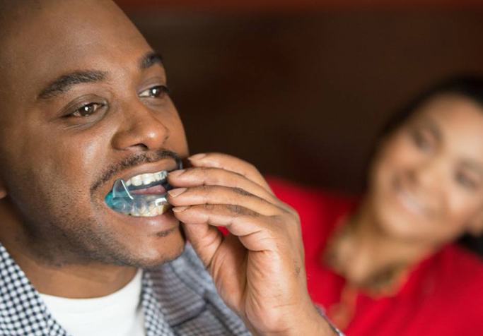 man putting in oral appliance