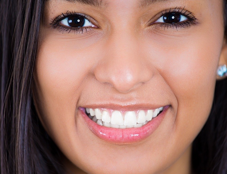 close up of woman smiling with perfect white smile