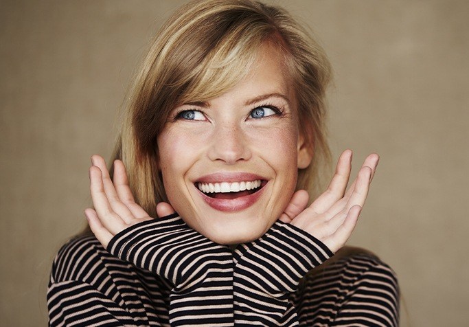 woman in striped shirt smiling