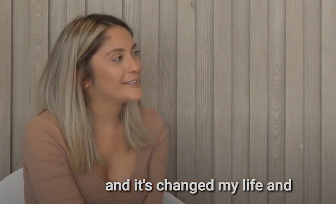 Dental patient Melissa looking off to the side with text reading and its changed my life and