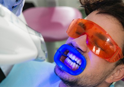 man getting in office teeth whitening