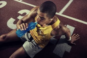 athlete drinking a sports drink