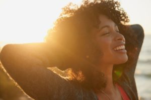 woman smiling in the sunset 