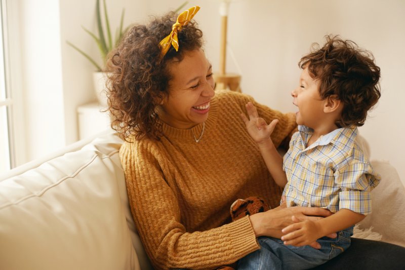 parent and child smiling at each other in Plainview