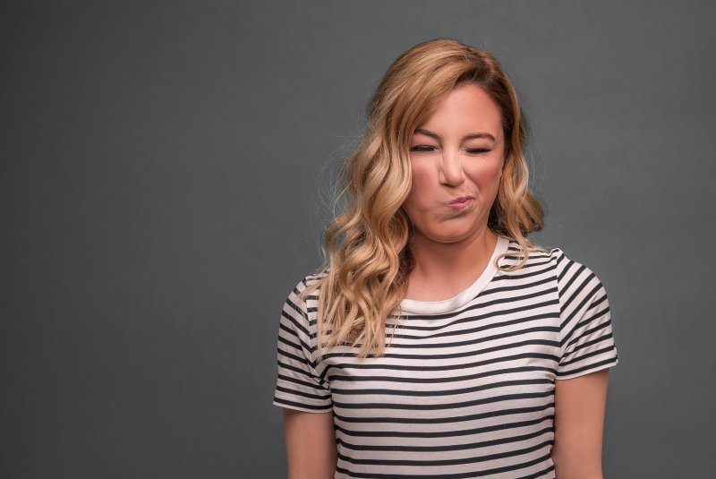 Patient wincing from a toothache